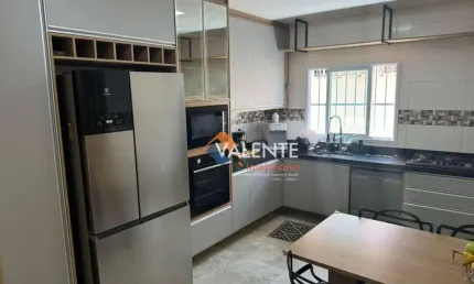 Casa com 3 dormitórios à venda, 120 m² por R$ 1.156.000,00 - Maracanã - Praia Grande/SP