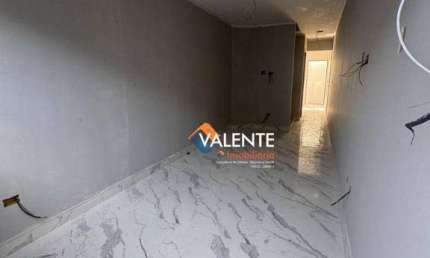 Casa com 2 dormitórios à venda, 70 m² por R$ 390.000,00 - Tude Bastos - Praia Grande/SP