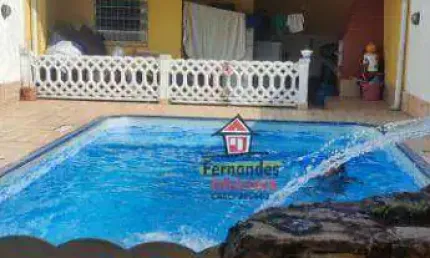 Casa térrea com piscina mais edícula , com 2 dormitórios à venda, 129 m² por R$ 720.000 - Caiçara - Praia Grande/SP