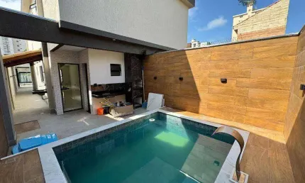 Casa com 3 dormitórios à venda, 140 m² por R$ 1.050.000,00 - Maracanã - Praia Grande/SP