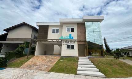 Casa em condomínio fechado com 3 quartos à venda no Cacupé, Florianópolis  por R$ 2.800.000