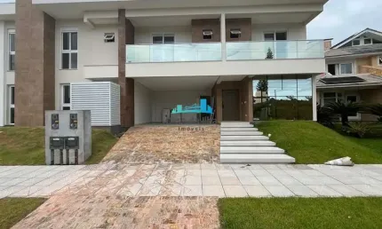 Casa em condomínio fechado com 3 quartos à venda no Cacupé, Florianópolis  por R$ 2.500.000