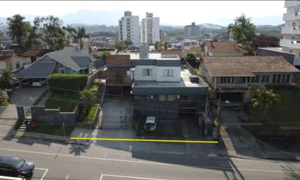 Terreno com casa e galpão Comercial Costa e Silva Joinville.