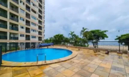 Sala Living em frente a praia do Gonzaguinha ,com vaga de garagem