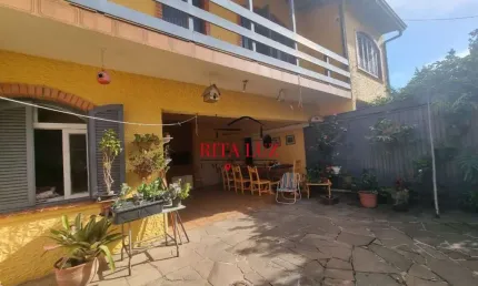 Casa em condomínio fechado com 4 quartos à venda na Rua Bernardino Caetano Fraga, 511, Medianeira, Porto Alegre por R$ 660.000