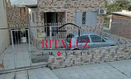 Casa com 3 quartos à venda na Rua Martim Minaberry, 395, Partenon, Porto Alegre por R$ 420.000