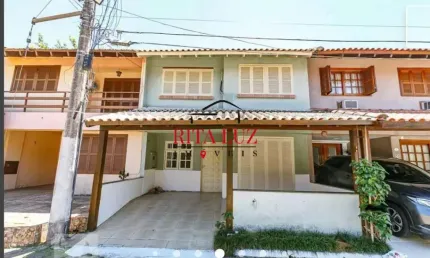 Casa em condomínio fechado com 3 quartos à venda na Avenida Juca Batista, 1492, Cavalhada, Porto Alegre por R$ 410.000