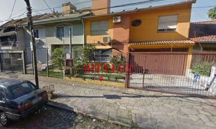 Casa em condomínio fechado com 3 quartos à venda na Rua Professor Guerreiro Lima, 1026, Partenon, Porto Alegre por R$ 850.000