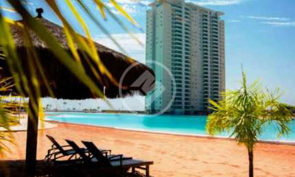 Apartamento condominio Brasil Beach de 88m2 com dois quartos sendo uma suíte, sacada com chiurrasqueira, banheiro social, lavabo, móveis planejados, duas vagas de garagem, depósito, área de lazer comp