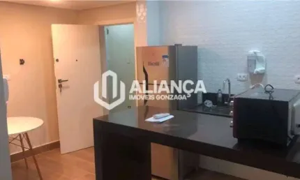 Kitnet no gonzaga prédio frente mar totalmente reformada