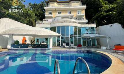 Casa de altíssimo padrão de frente para o mar com 11 suítes, lazer completo e 6 vagas - Península, Guarujá.