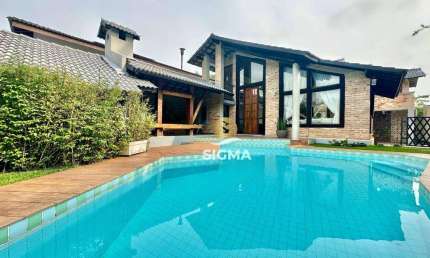 Casa com 4 Suítes à venda no Condomínio Jardim Acapulco - Guarujá/SP.