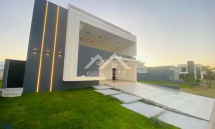 Sobrado alto padrão com 5 suítes e área de lazer com piscina em condomínio fechado em Peruíbe