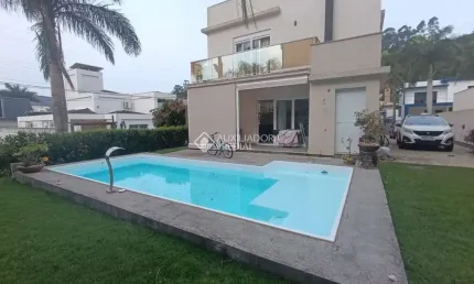 Casa em condomínio fechado com 3 quartos à venda na Rua Leonel Pereira, 2239, Cachoeira do Bom Jesus, Florianópolis, 320 m2 por R$ 2.100.000