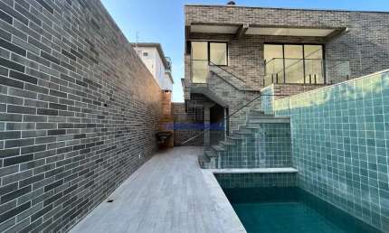 Casa em condomínio fechado com 3 quartos à venda na Delphin Moreira, --, Embaré, Santos por R$ 1.800.000