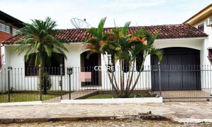 Casa 3 dormitórios 1  suíte  3 vagas de garagem localizada no Bairro Nsª . Srª.