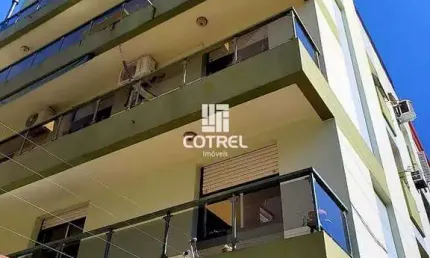 Apartamento semimobiliado com 2 dormitórios, suíte e garagem no Edifício Votron