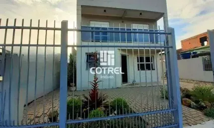 Casa 4 dormitórios 1 suíte 2 vagas de garagem localizada no Bairro Urlândia na c