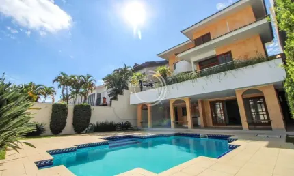 Casa de alto padrão em condomínio isaura 600 m² com piscina, área gourmet e 5 suites