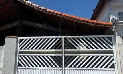 Casa térrea geminada com 2 dormitórios à venda, 70 m² por R$ 399.000 - Maracanã - Praia Grande/SP