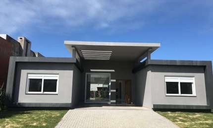 Casa em condomínio fechado com 4 quartos à venda na Rua Onório Germano, 2009, Araça, Capão da Canoa por R$ 1.560.000