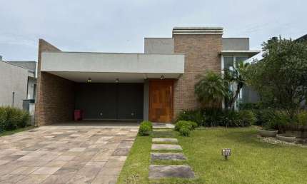 Casa em condomínio fechado com 4 quartos à venda na Rua Onório Germano, 2009, Araça, Capão da Canoa por R$ 1.600.000