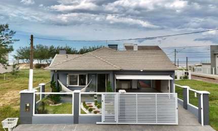 Casa com 4 quartos à venda na Rua Porto Belo, 1097, Atlântida, Capão da Canoa, 176 m2 por R$ 949.000