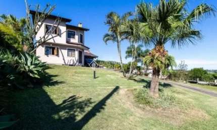 Casa em condomínio fechado com 3 quartos para alugar na Rua Flor de Pessegueiro, 105, Vila Nova, Porto Alegre, 249 m2 por R$ 7.000