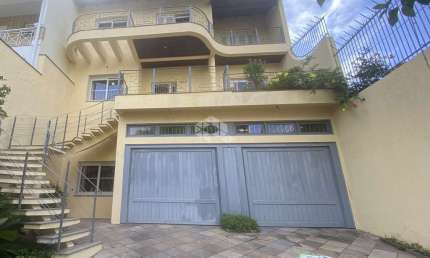 Casa com 5 quartos à venda na Rua Isidoro Tressi, 507, Jardim Botânico, Porto Alegre