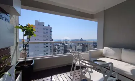 Apartamento semi mobiliado com 3 suítes,  sendo 2 suítes no modelo americana com 2 vagas de garagem