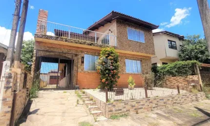 Casa em com 6 dormitórios, 5 vagas de garagem em Canoas Bairro estância Velha.