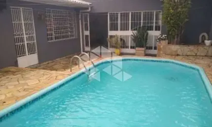 Casa 3 dormitórios com 1 Suíte, reformada, Piscina, semimobiliada, churrasqueira gourmet, vaga 3 carros, Aceita financiamento/ Rio Branco/Canoas.