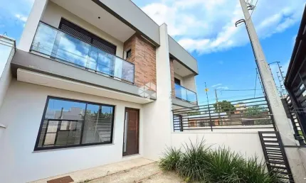 Casa NOVA 3 dormitórios, 1 suíte com sacada, living 2 ambientes, churrasqueira, no Bairro Igara/Canoas. Aceita Financiamento bancário e FGTS