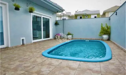 Casa 3 dormitórios, 2 suítes, 4 vagas com piscína, bairro Mont Serrat Canoas -Rs