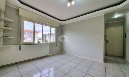 Apartamento com 02 dormitórios, banheiro social, living para 02 ambientes, cozinha, área de serviço, banheiro auxiliar e garagem coberta