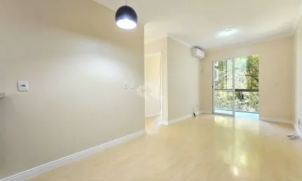 Apartamento com 2 Dormitórios/Quartos , living para 2 ambientes e uma sacada com churrasqueira, 1 vaga de garagem coberta no bairro Marechal Rondon