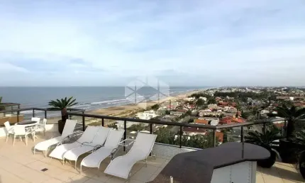 Cobertura 4 dormitórios de frente para o mar em capão da canoa!