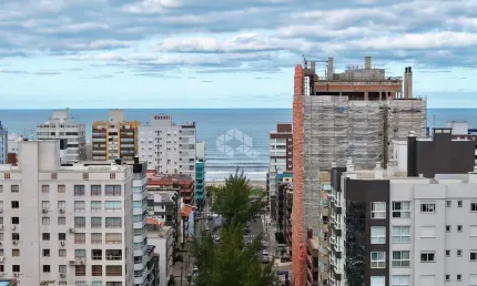 Dois dormitórios no centro de capão com vista mar mobiliado