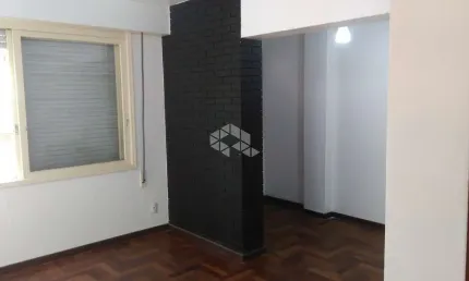 Apartamento de um dormitório semi mobiliado  no centro
