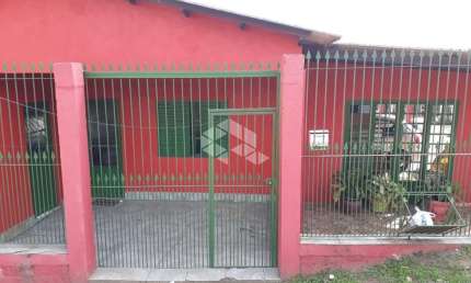 Casa com cinco dormitórios no bairro Aparecida em Alvorada-RS.
