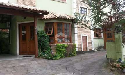 Casa em condomínio fechado, 04 dormitórios, 04 vagas de garagem no bairro Ecoville em Porto Alegre/RSCredito Real Floresta Vende