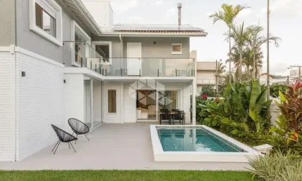 Casa residencial semimobiliada com 5 suítes, 2 vagas de garagem - Jurerê - Floripa/SC