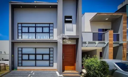 CASA DE ALTO PADRÃO EM CONDOMINIO CLUBE COM 3 SUÍTES NO BAIRRO BEIRA-RIO EM BIGUAÇU/SC