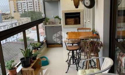 APARTAMENTO SEMIMOBILIADO COM VISTA PARA O MAR 3 QUARTOS SENDO 2 SUÍTES 2 VAGAS DE GARAGEM NO BALNEÁRIO EM FLORIANÓPOLIS/SC