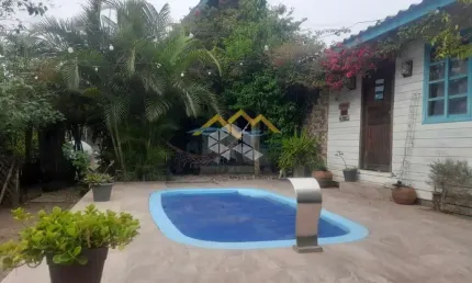 Casa com 4 quartos, 2 vagas, 336,55m² de área total na Praia do Rosa - Imbituba SC