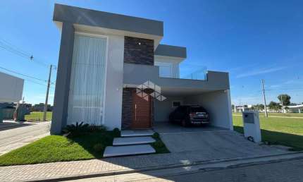 Casa à venda em condomínio fechado em Eldorado do Sul com 3 dormitórios e 2 vagas