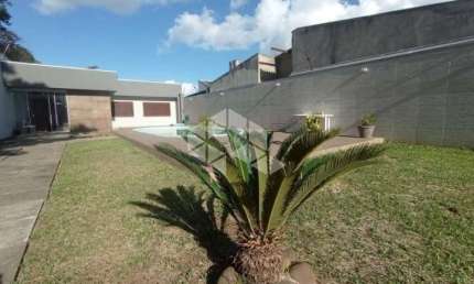 Casa no bairro Niterói com 4 dormitórios, 2 suítes e piscina com terreno 11x50