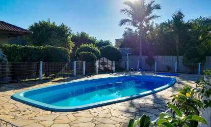 Casa em condomínio fechado semi mobiliada 90m² 02 dormitórios 02 vagas cobertas no Bairro Rio Branco, em Canoas
