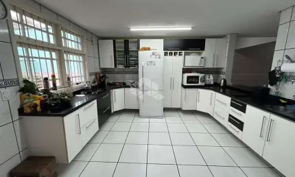 Casa com 3 quartos à venda na Rua Jerolomo Minuzo, 146, Vila Nova, Porto Alegre