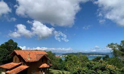 Terreno a venda  com dois sobrados em Canajurê com vista mar